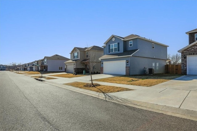 view of front of house featuring central AC unit and a garage