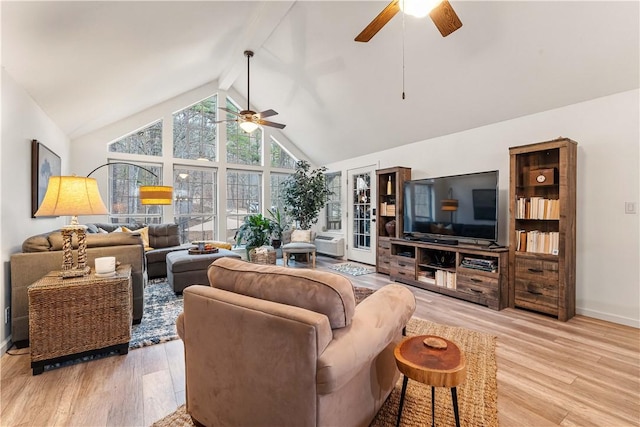 living room with beam ceiling, light hardwood / wood-style flooring, high vaulted ceiling, and ceiling fan