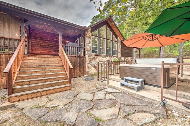 view of patio / terrace featuring a hot tub