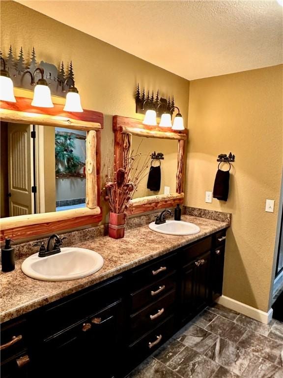 bathroom featuring vanity and a textured ceiling