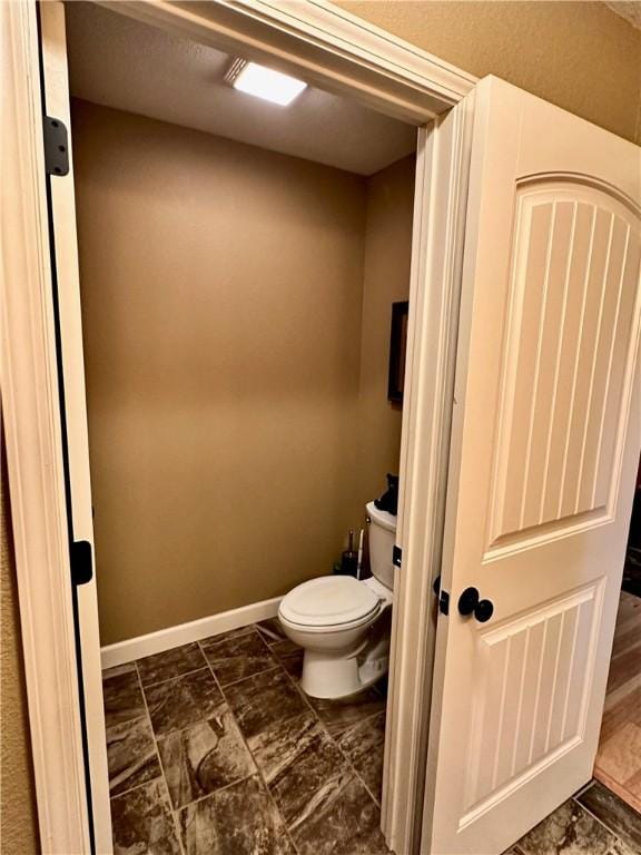 329 Bradley Ridge Rd, Marshall, AR 72650 - bathroom featuring baseboards and marble look tiles