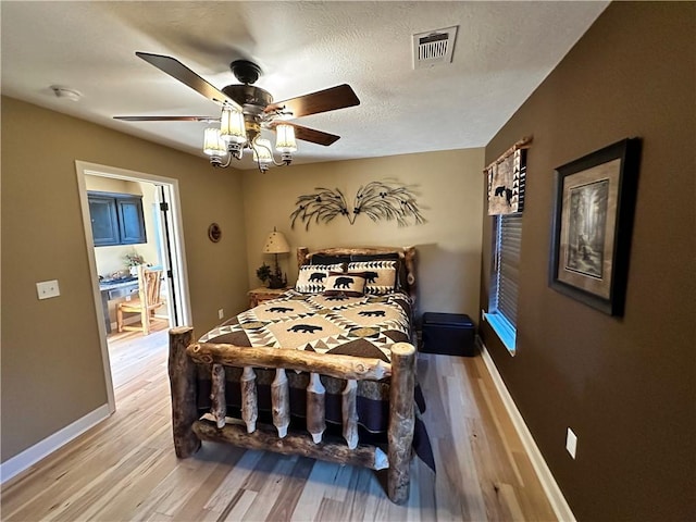 329 Bradley Ridge Rd, Marshall, AR 72650 - bedroom with light wood-type flooring and ceiling fan