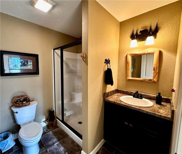 bathroom featuring walk in shower, tile patterned floors, a textured ceiling, toilet, and vanity