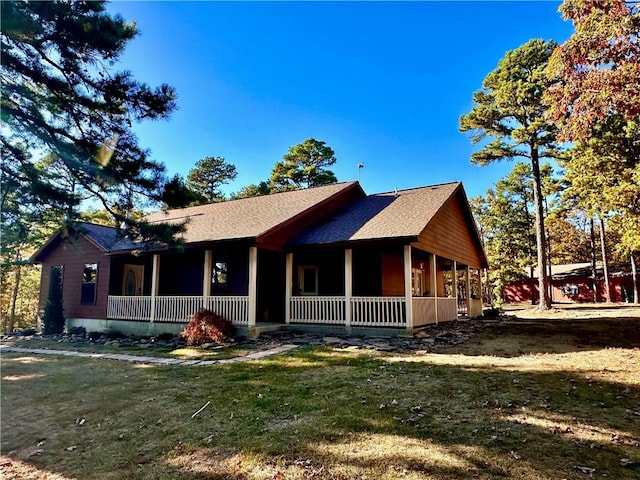329 Bradley Ridge Rd, Marshall, AR 72650 - view of front of property featuring a porch, roof with shingles, and a front yard