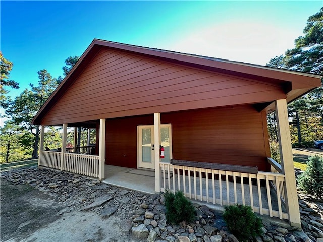 view of side of property with a porch