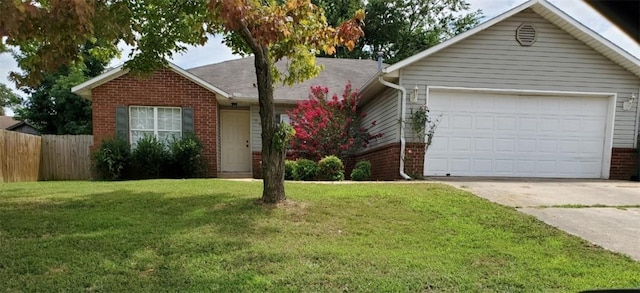 single story home featuring a garage and a front lawn