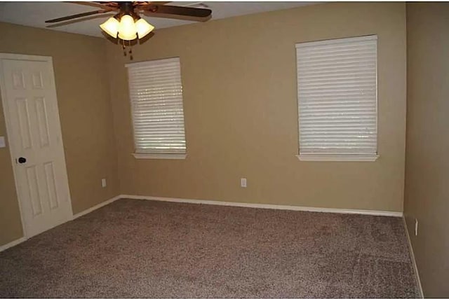 empty room featuring carpet and ceiling fan