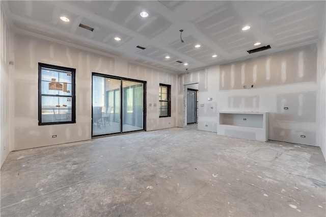 unfurnished living room featuring visible vents