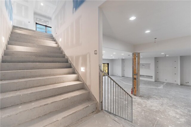 staircase with recessed lighting