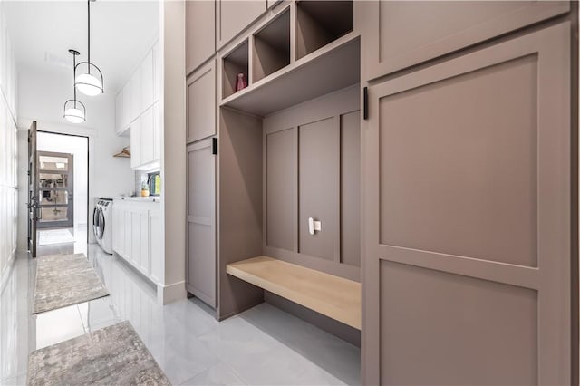 mudroom with independent washer and dryer
