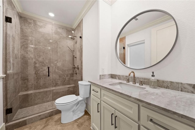 bathroom featuring vanity, toilet, a shower with door, and crown molding