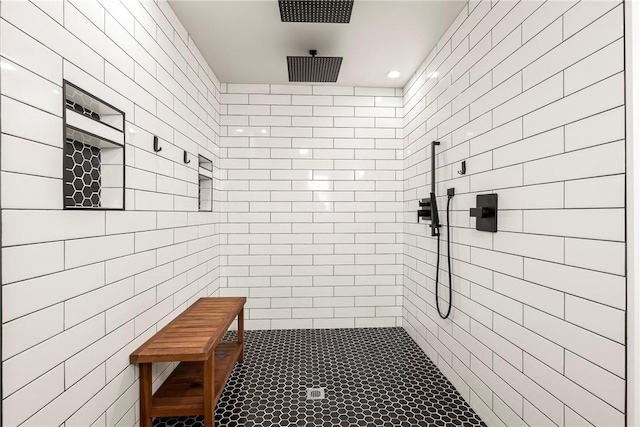 bathroom with a tile shower