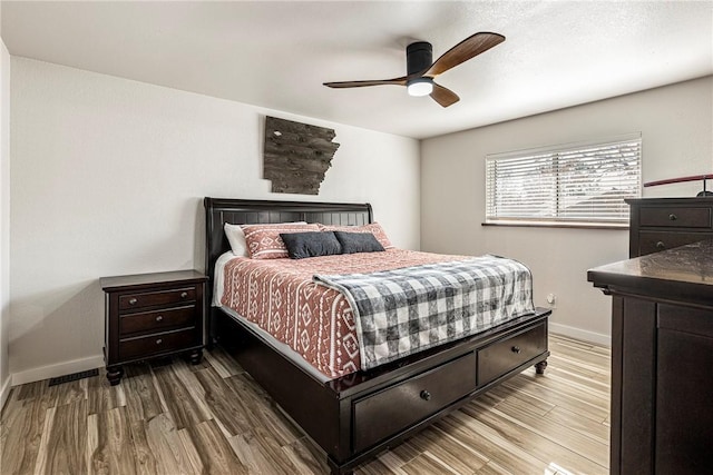 bedroom featuring hardwood / wood-style flooring and ceiling fan