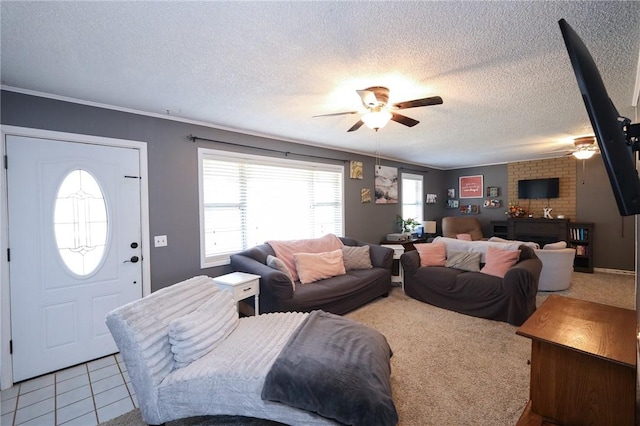 carpeted living room featuring a textured ceiling, ceiling fan, and crown molding