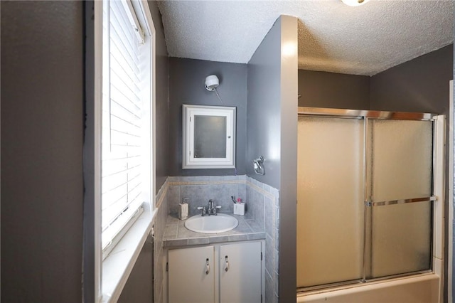 8446 Sagamore Loop, Harrison, AR 72601 - full bathroom with a textured ceiling, an enclosed shower, and vanity