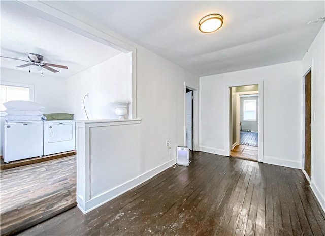 interior space with washer and dryer, ceiling fan, and dark hardwood / wood-style flooring