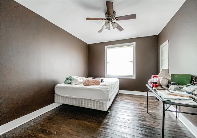 bedroom featuring ceiling fan and dark wood-type flooring