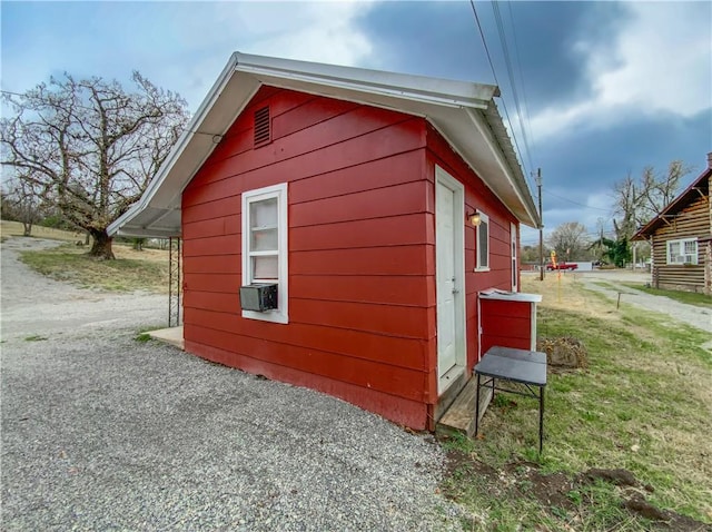 view of home's exterior with cooling unit and a yard