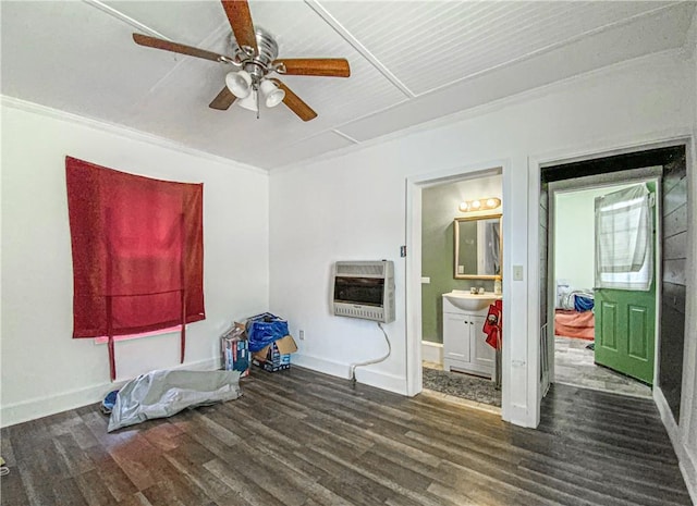 miscellaneous room featuring ornamental molding, heating unit, ceiling fan, dark wood-type flooring, and sink