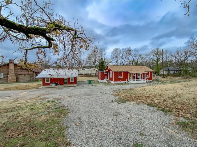 view of front of home featuring an outbuilding