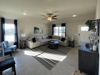 living room featuring ceiling fan