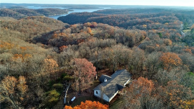 birds eye view of property with a forest view