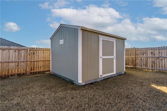 view of outbuilding with a yard