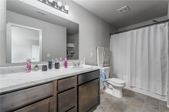 full bathroom with shower / bathtub combination with curtain, vanity, a textured ceiling, and toilet