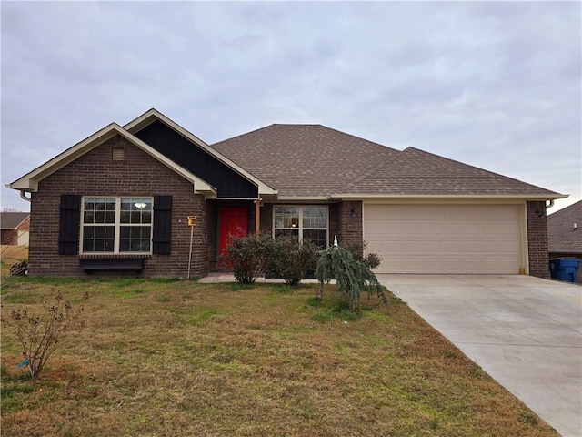 ranch-style home featuring a front lawn and a garage