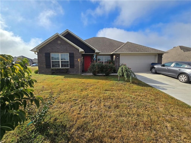 ranch-style home featuring a front lawn and a garage