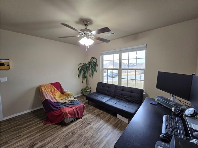 living room featuring ceiling fan and dark hardwood / wood-style flooring