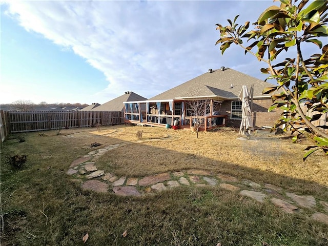 view of yard with a sunroom