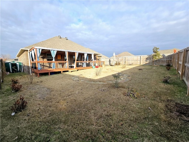 rear view of house featuring a deck