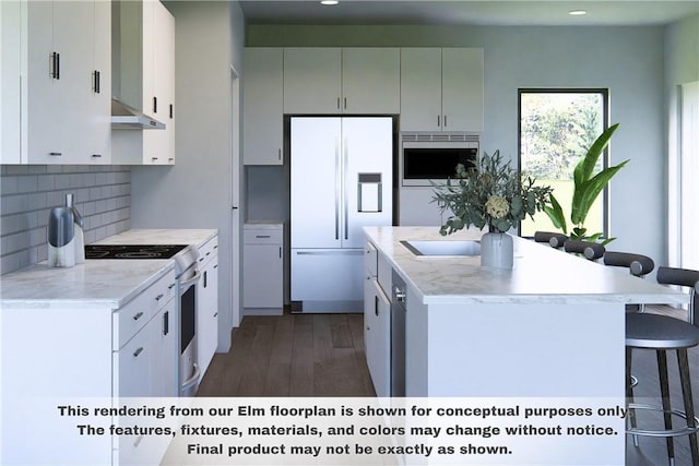 kitchen featuring white cabinetry, a kitchen breakfast bar, dark hardwood / wood-style floors, white appliances, and decorative backsplash