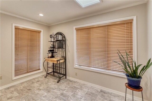 sitting room featuring crown molding