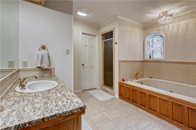 bathroom with separate shower and tub, tile patterned floors, vanity, and ornamental molding