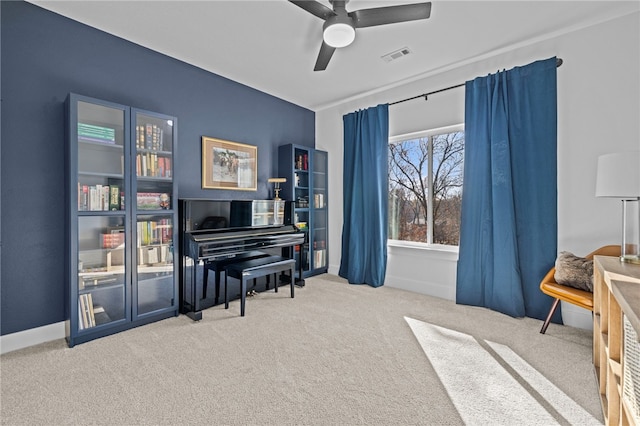 miscellaneous room featuring ceiling fan and carpet floors