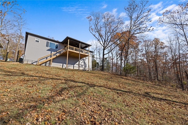 back of house featuring a deck