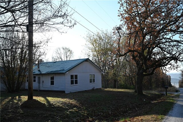 view of side of home featuring a yard