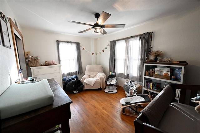 bedroom featuring hardwood / wood-style floors and ceiling fan