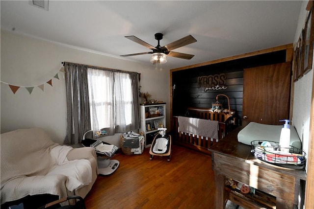 bedroom with ceiling fan and hardwood / wood-style floors