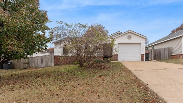 view of front facade with a garage and a front lawn