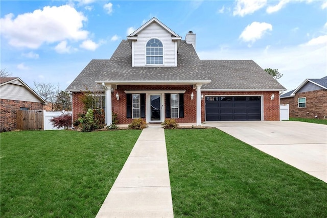 view of front of property with a front lawn and a garage