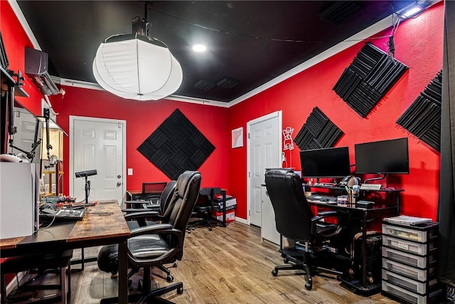 home office with crown molding and hardwood / wood-style floors