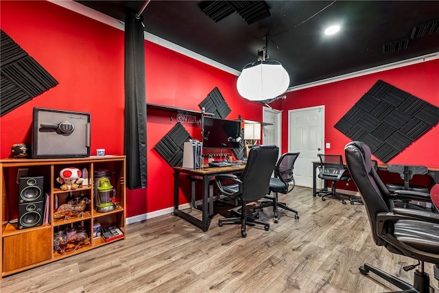 office space with hardwood / wood-style floors and ornamental molding