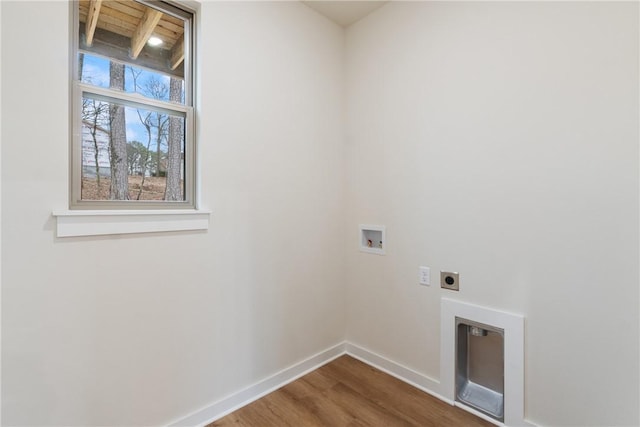 laundry room with hardwood / wood-style flooring, hookup for a washing machine, and electric dryer hookup