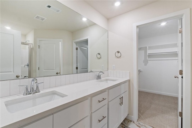 bathroom with vanity and an enclosed shower