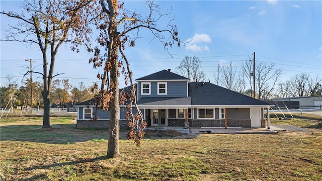 view of front of home with a front lawn and covered porch