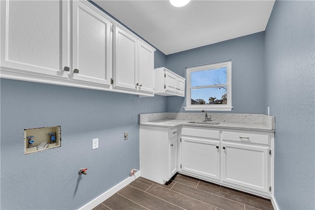 laundry area featuring cabinets, washer hookup, gas dryer hookup, and sink