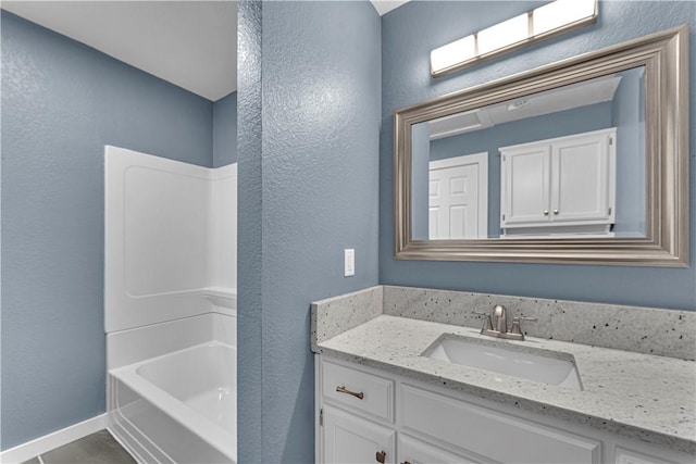 bathroom featuring vanity and tub / shower combination